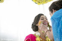 Indian bride is smeared in yellow turmeric paste. Indian bride is smeared in yellow turmeric paste.
