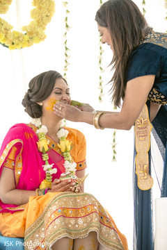 Ritual of painting the bride with yellow turmeric paste Ritual of painting the bride with yellow turmeric paste