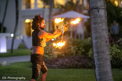 Bollywood dancer performing a dance with fire. Bollywood dancer performing a dance with fire.
