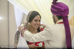 Indian groom putting the garland to bride ritual. Indian groom putting the garland to bride ritual.