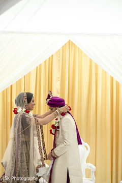 Maharani putting the garland to groom. Maharani putting the garland to groom.