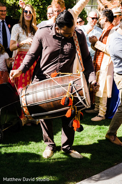 Dhol player during Baraat Dhol player during Baraat