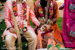 Indian groom holding Maharani's hand Indian groom holding Maharani's hand