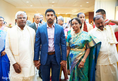 Indian groom with his parents Indian groom with his parents