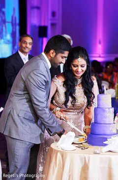 See this lovely Indian couple cutting cake. See this lovely Indian couple cutting cake.