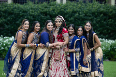 Indian bride and bridesmaids posing outdoors capture. Indian bride and bridesmaids posing outdoors capture.