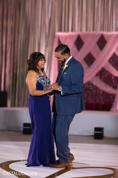 Indian groom dancing with mother photo. Indian groom dancing with mother photo.