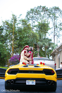 Incredible Indian couple posing on their wedding vehicle. Incredible Indian couple posing on their wedding vehicle.