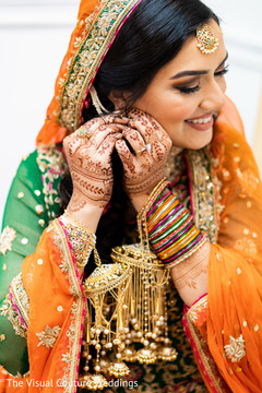 Indian bride showing her mehndi and jewelry Indian bride showing her mehndi and jewelry
