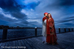 Indian bride and groom by the pier Indian bride and groom by the pier