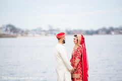 Indian bride and groom by the water Indian bride and groom by the water