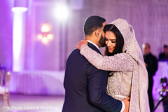 Indian bride dancing with groom at the reception Indian bride dancing with groom at the reception