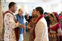 Indian groom looking at his bride entrance to ceremony. Indian groom looking at his bride entrance to ceremony.