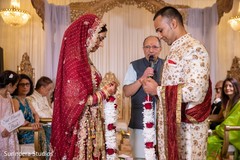 Indian bride and groom exchanging garlands ritual. Indian bride and groom exchanging garlands ritual.