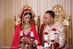 Indian bride and groom holding hands at ceremony Indian bride and groom holding hands at ceremony