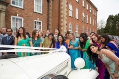 Indian wedding guests admiring Indian couple's vehicle. Indian wedding guests admiring Indian couple's vehicle.