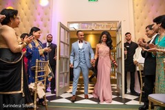 Indian newlyweds making their entrance to wedding reception Indian newlyweds making their entrance to wedding reception