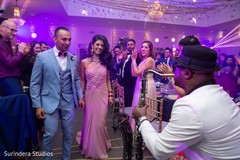 Indian lovebirds grand entrance to wedding reception Indian lovebirds grand entrance to wedding reception