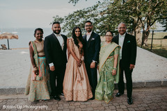 Indian bride and groom with family picture Indian bride and groom with family picture