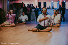 Indian wedding guests performing a fun choreography Indian wedding guests performing a fun choreography