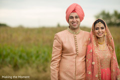 Indian bride and groom posing for pictures Indian bride and groom posing for pictures