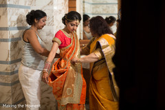Indian bride being assisted bu special guests Indian bride being assisted bu special guests
