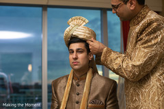Indian groom being assisted by special guest Indian groom being assisted by special guest