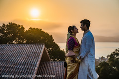 Indian bride and groom posing by the sun Indian bride and groom posing by the sun