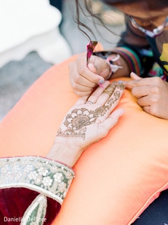 Beautiful indian bride getting her henna art done. Beautiful indian bride getting her henna art done.