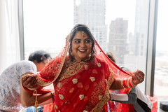 Indian bride getting her wedding attire on. Indian bride getting her wedding attire on.