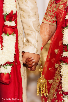 Closeup capture of Indian couple's hands at ceremony. Closeup capture of Indian couple's hands at ceremony.
