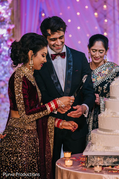 Indian bride and groom cutting cake moment. Indian bride and groom cutting cake moment.