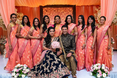 Glamorous Indian couple posing with bridesmaids. Glamorous Indian couple posing with bridesmaids.