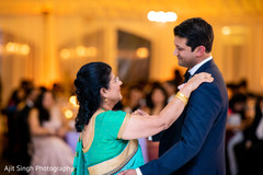 Indian groom dancing with his mother capture. Indian groom dancing with his mother capture.
