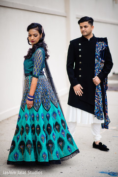 Indian bride and groom posing for pictures Indian bride and groom posing for pictures