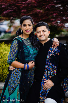 Indian bride and groom posing for pictures Indian bride and groom posing for pictures