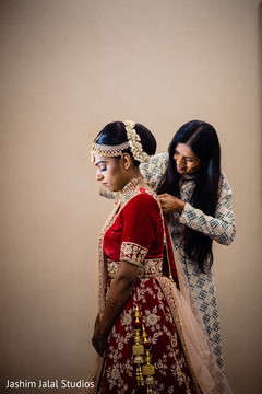 Indian bride being assisted by special guest Indian bride being assisted by special guest