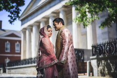 Indian groom holding Maharani's hands Indian groom holding Maharani's hands