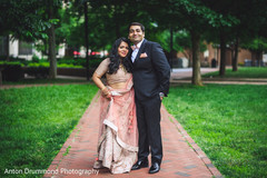 Indian bride and groom posing for the photo shoot Indian bride and groom posing for the photo shoot