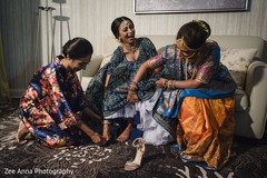 Maharani putting her ceremony shoes. Maharani putting her ceremony shoes.