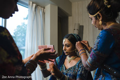Indian bride getting her nose ring on. Indian bride getting her nose ring on.