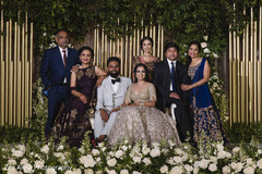 Adorable indian couple posing with family. Adorable indian couple posing with family.