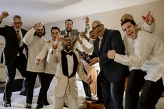 Rajah celebrating with groomsmen capture. Rajah celebrating with groomsmen capture.