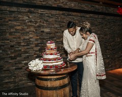 Indian wedding cutting cake moment capture. Indian wedding cutting cake moment capture.