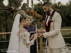 Indian groom putting wedding ring to bride. Indian groom putting wedding ring to bride.