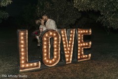 Indian bride and groom outdoors kiss capture. Indian bride and groom outdoors kiss capture.