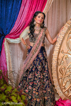 Glamorous indian bride posing on her sangeet lehenga. Glamorous indian bride posing on her sangeet lehenga.