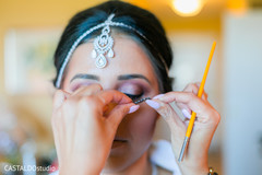 Indian bridal getting her makeup done. Indian bridal getting her makeup done.