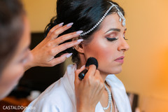 Indian bride getting the last touch ups of makeup. Indian bride getting the last touch ups of makeup.