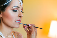 Maharani getting her lips color. Maharani getting her lips color.